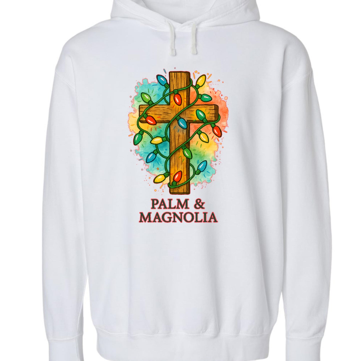 White hoodie with rustic wooden cross wrapped in colorful Christmas lights and "Palm & Magnolia" text.