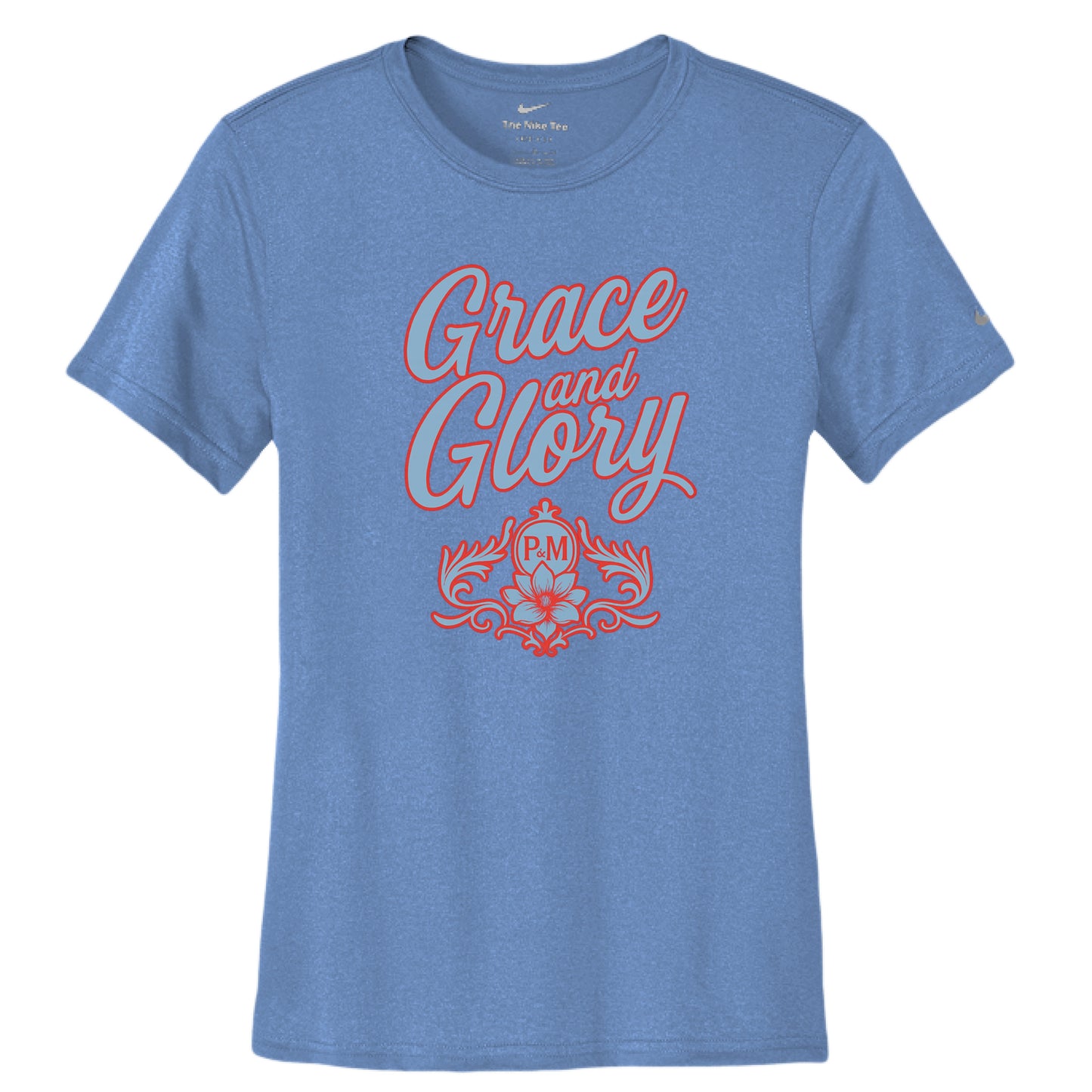 Women's powder blue Nike Dri-FIT tee with "Grace and Glory" text and floral emblem.