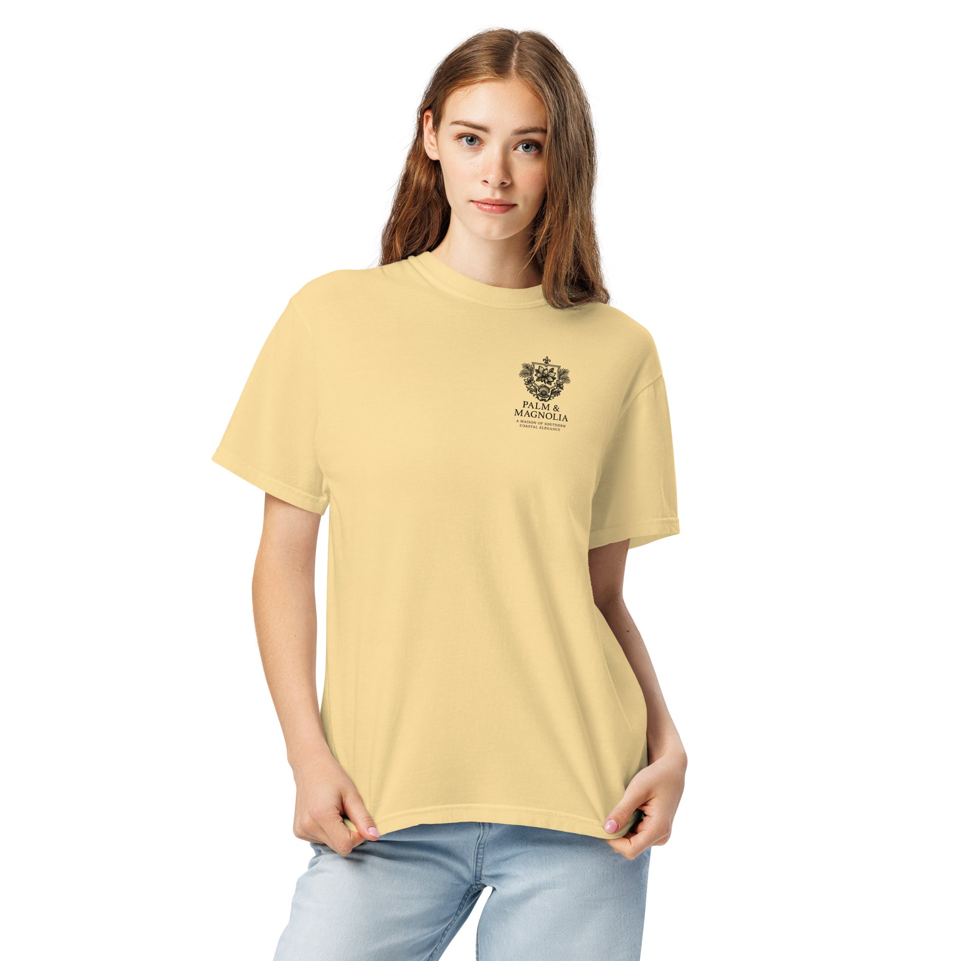 A woman models a relaxed-fit, pale yellow Comfort Colors T-shirt with a Hard Rock Bronco graphic.