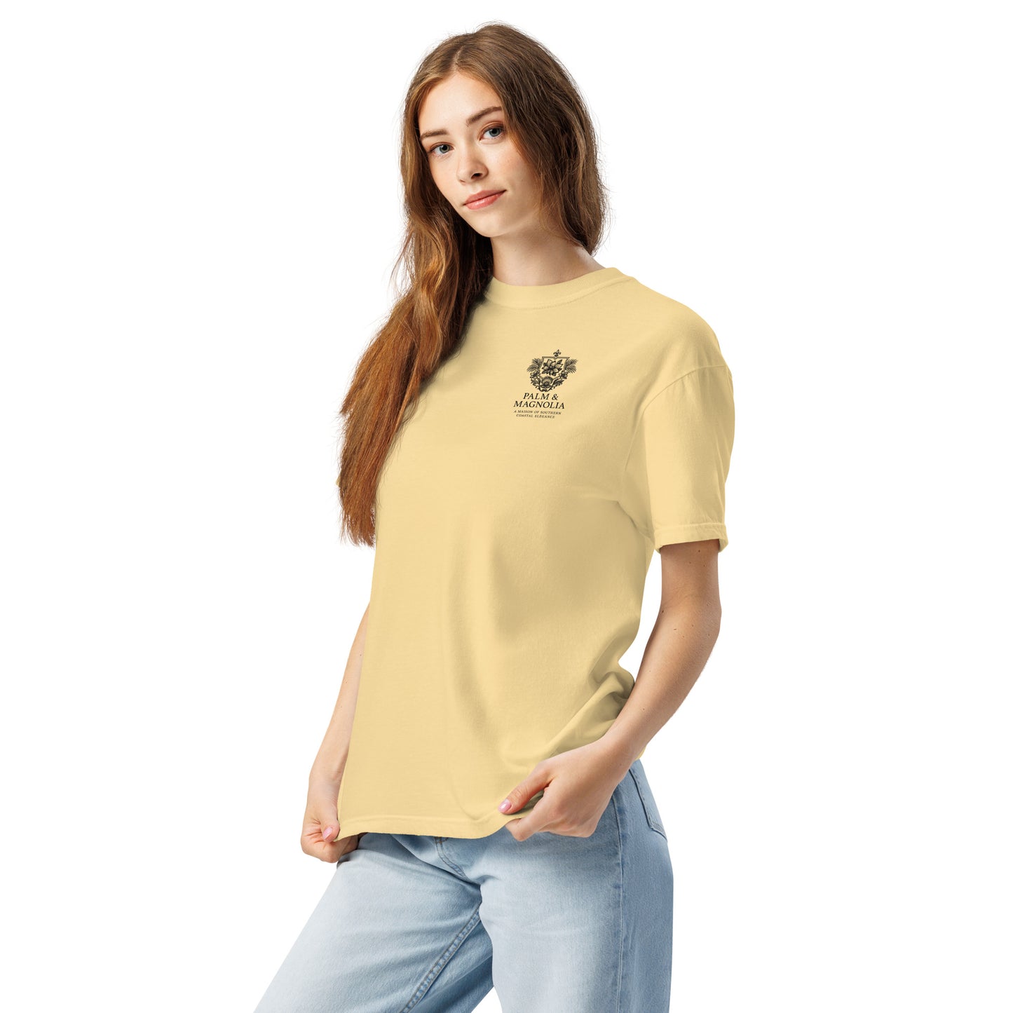 A woman models a pale yellow Comfort Colors tee with a black Hard Rock Bronco graphic on the chest.