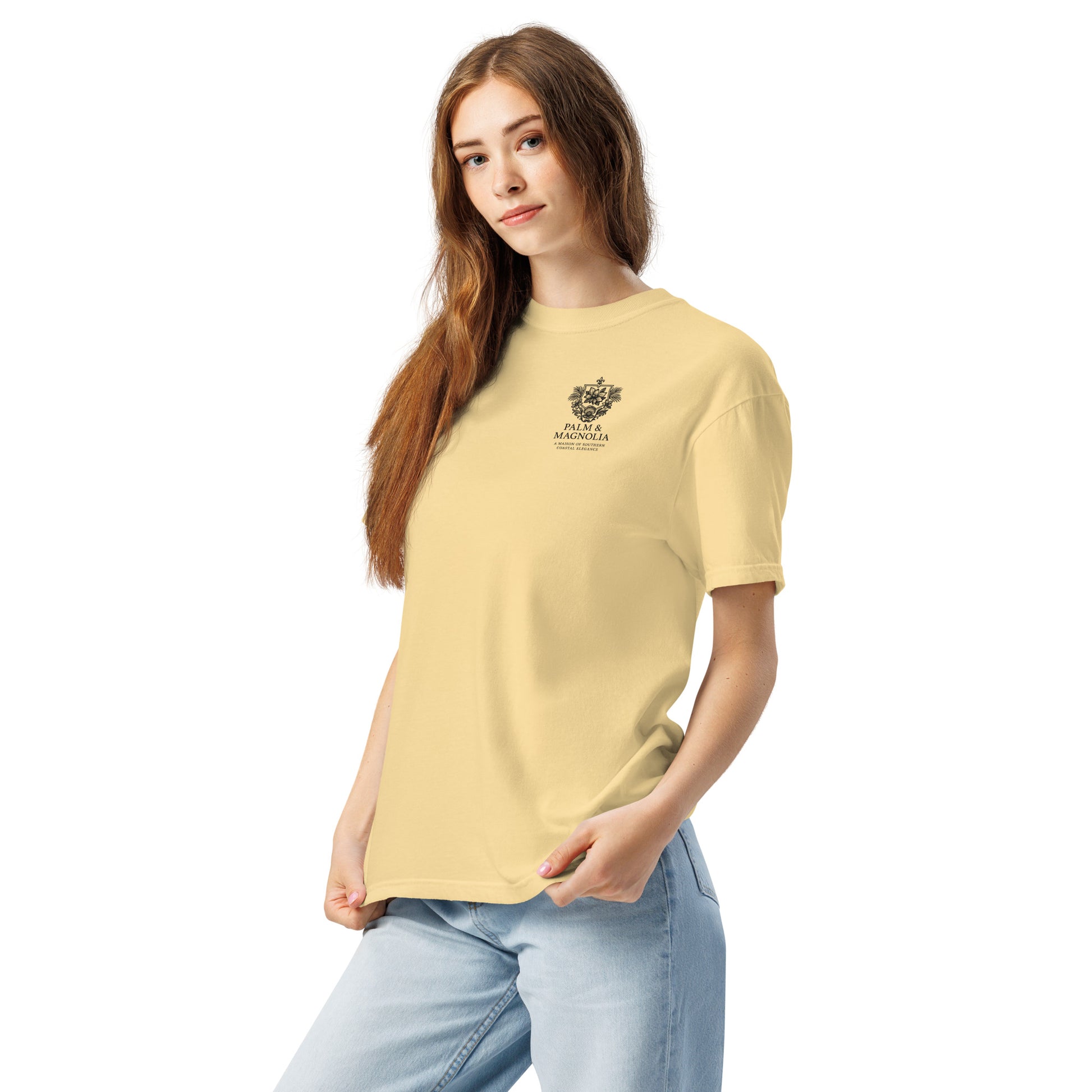 A woman models a pale yellow Comfort Colors tee with a black Hard Rock Bronco graphic on the chest.