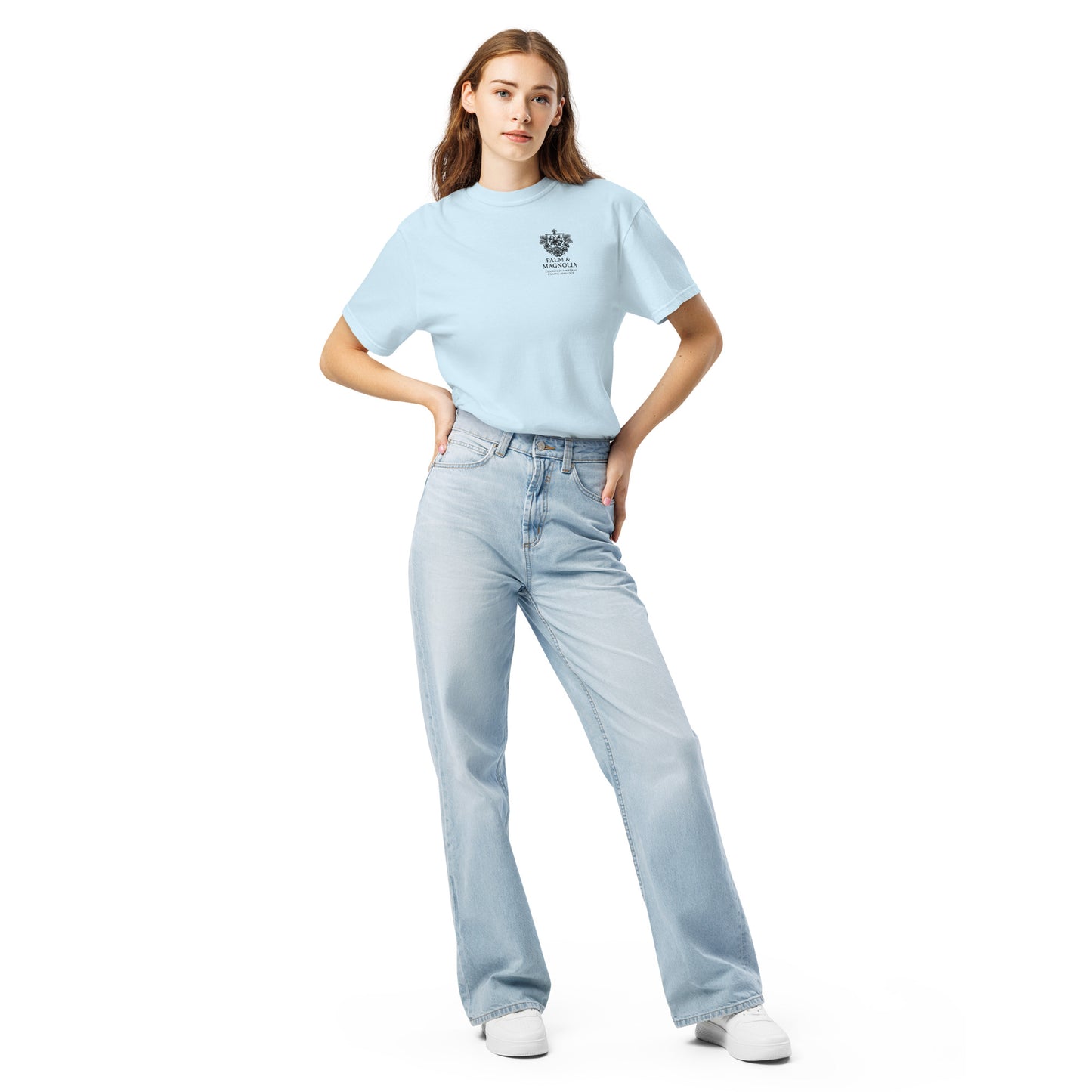 Woman modeling light blue Comfort Colors tee with Hard Rock Bronco graphic and relaxed-fit jeans.