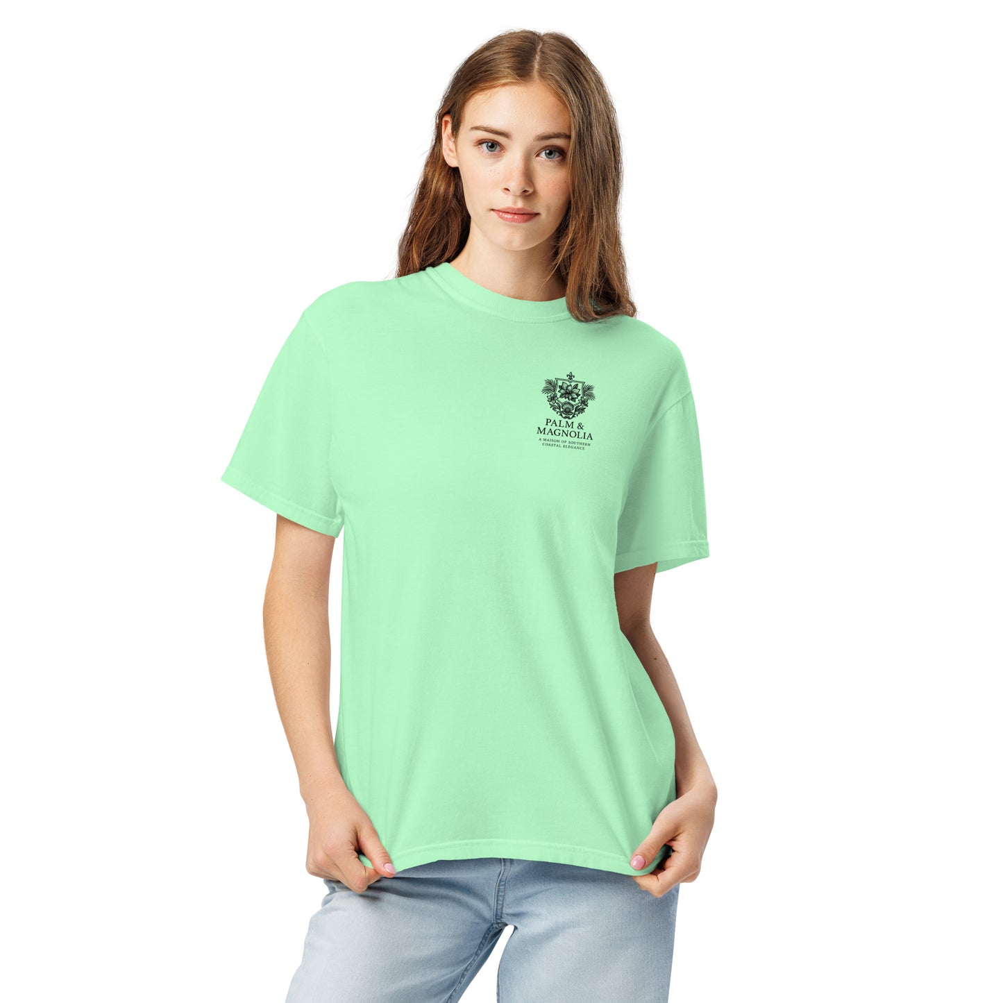 Woman modeling a light green Comfort Colors T-shirt with a Coastal Companions Hard Rock Bronco graphic.