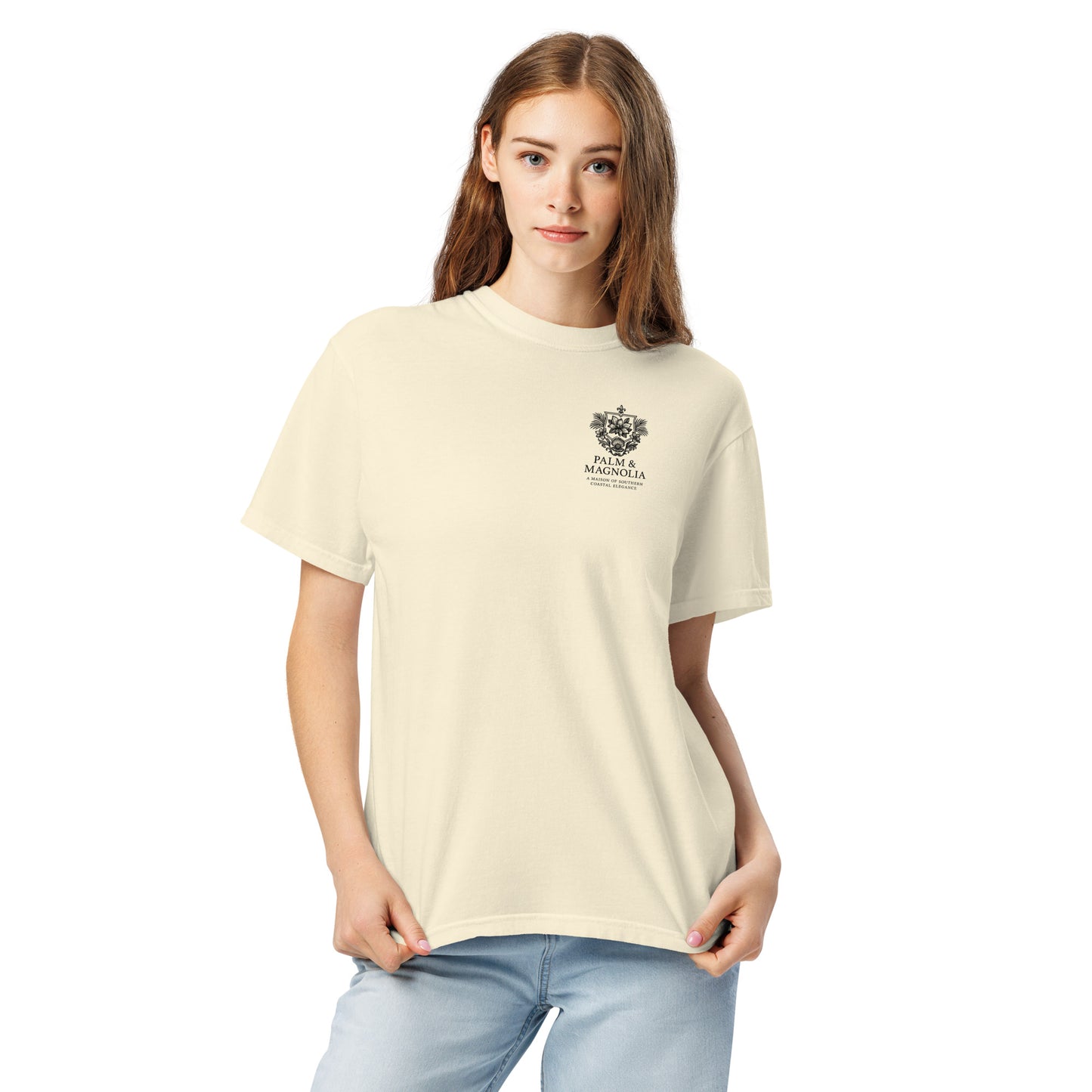Cream-colored Comfort Colors tee with Coastal Companions Hard Rock Bronco graphic on a model.