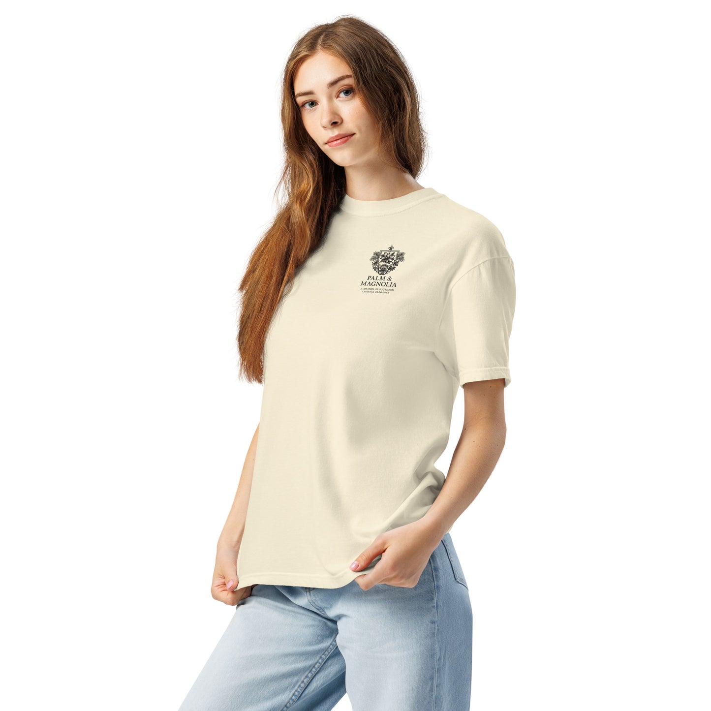 Woman modeling a cream short-sleeve tee with a Hard Rock Bronco graphic on the chest.