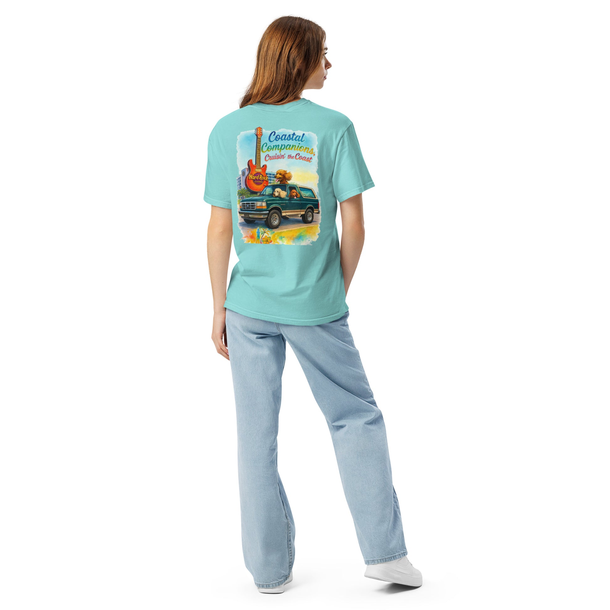 Back view of a woman wearing a light blue Comfort Colors tee with coastal graphic of guitar and Bronco.