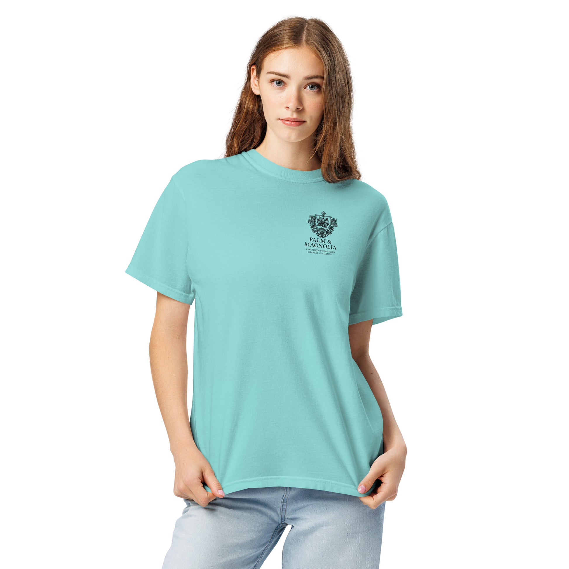 A woman models a relaxed-fit, light blue Comfort Colors T-shirt with a Hard Rock Bronco graphic.