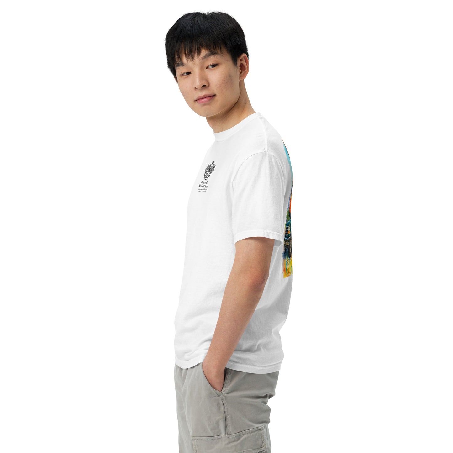 Side view of a man modeling a white Comfort Colors short-sleeve tee with colorful Coastal Companions back print.