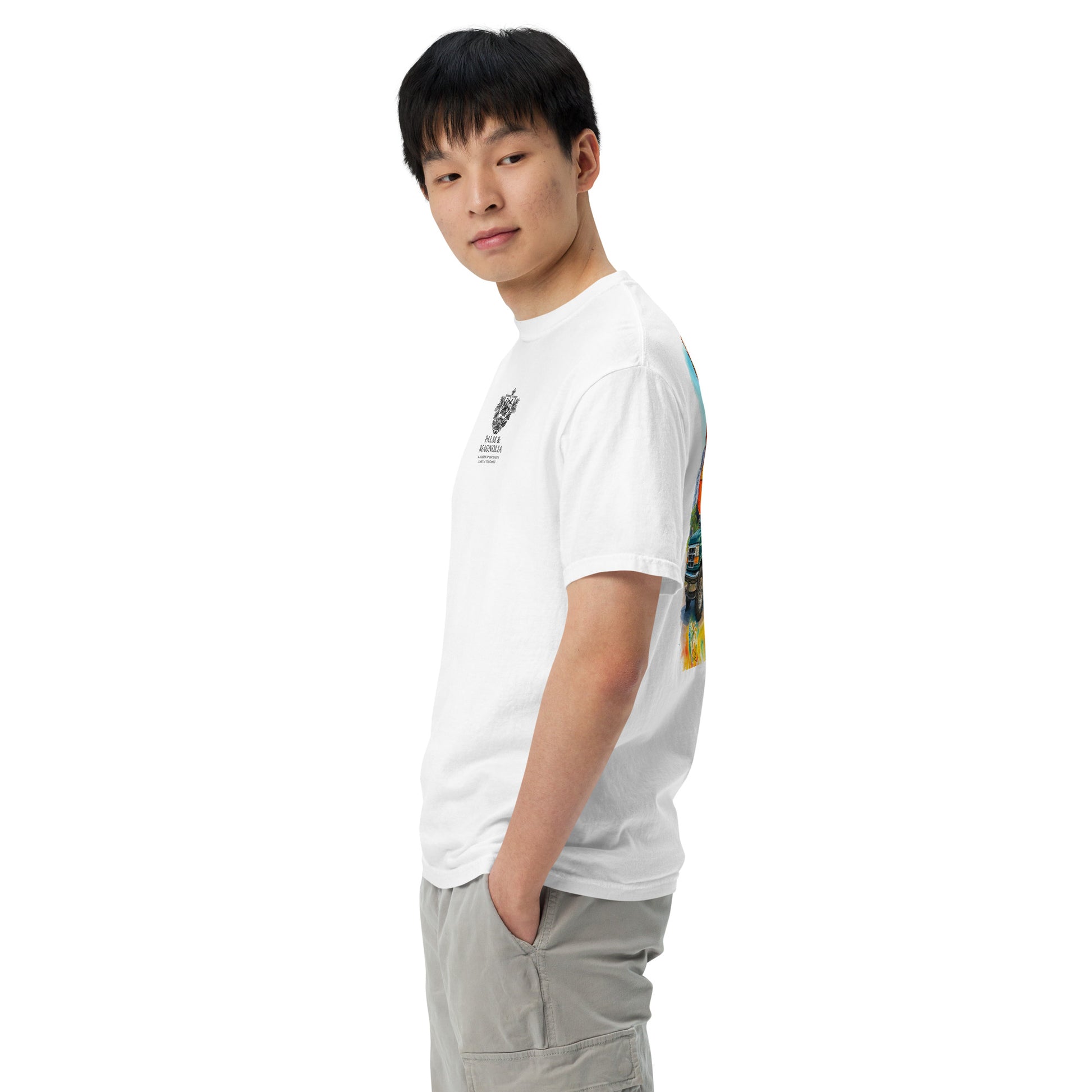 Side view of a man modeling a white Comfort Colors short-sleeve tee with colorful Coastal Companions back print.
