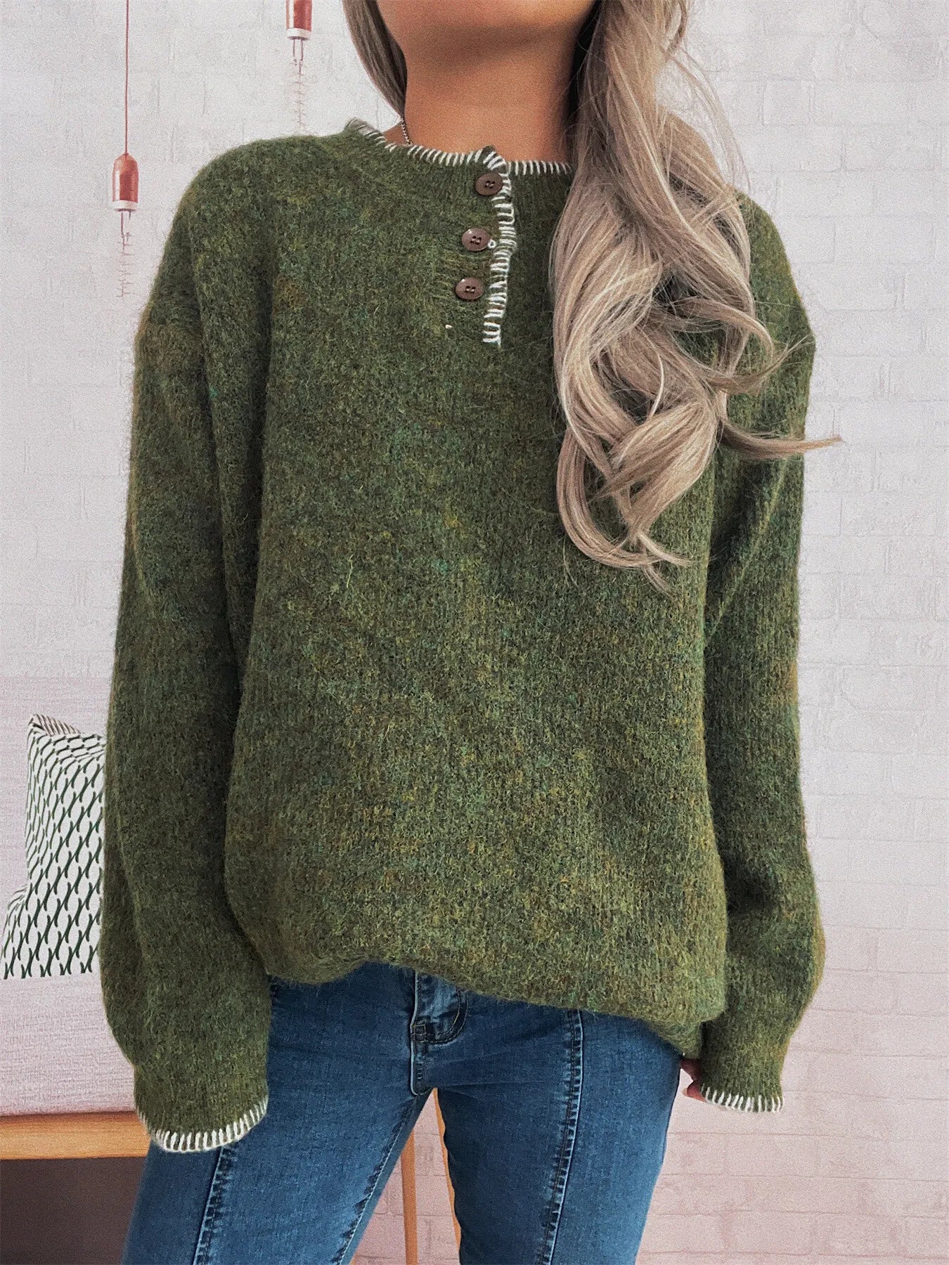 Oversized ribbed sweater in polyester with button details and contrast stitching.