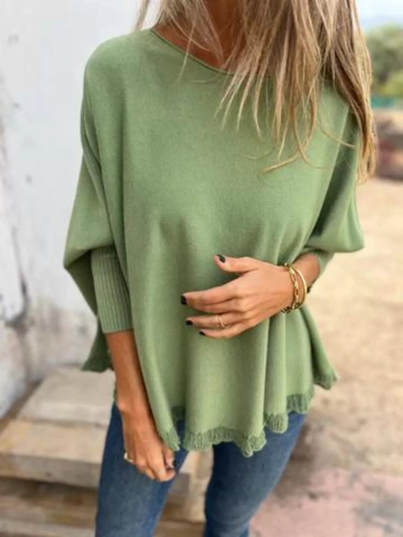 Plus size round neck long sleeve knit top with lace trim in soft polyester fabric.