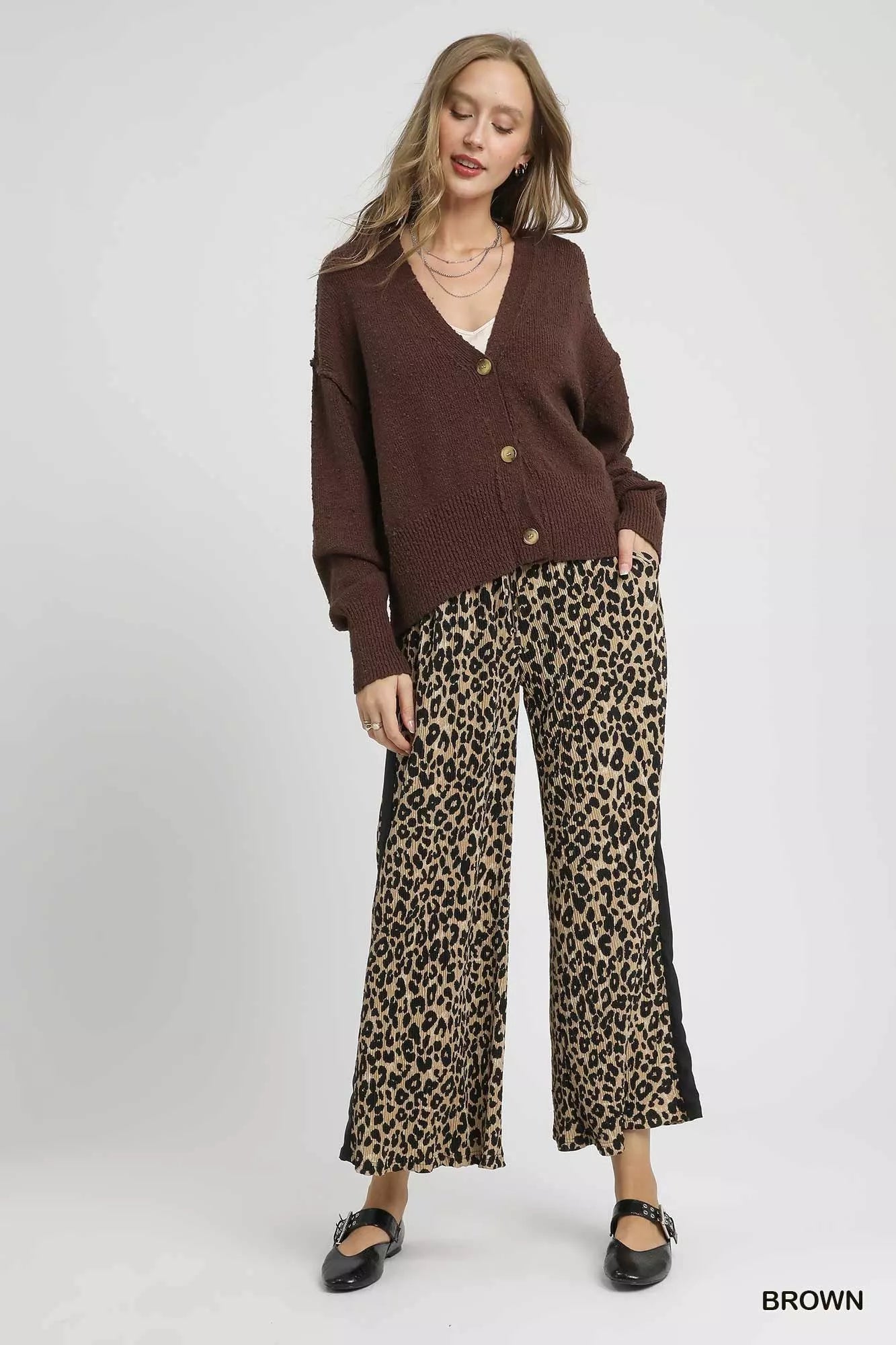 Woman modeling hemlock brown button-front V-neck knit cardigan.