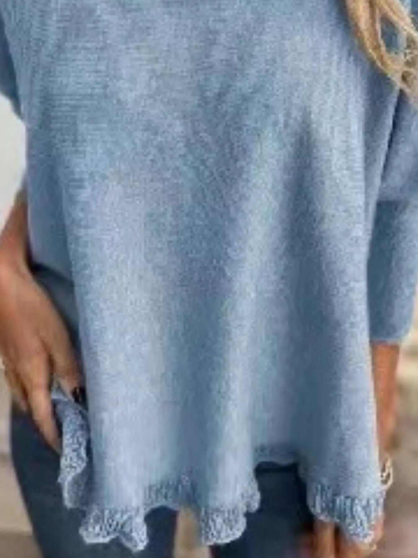 Plus size long sleeve knit top with round neck and delicate lace trim in soft fabric