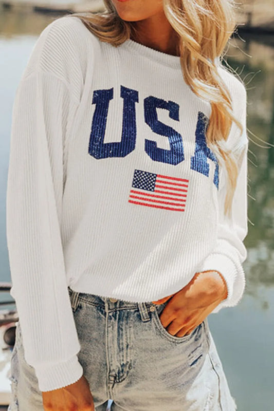 A long sleeve sweatshirt featuring a US flag design in a polyester blend fabric.