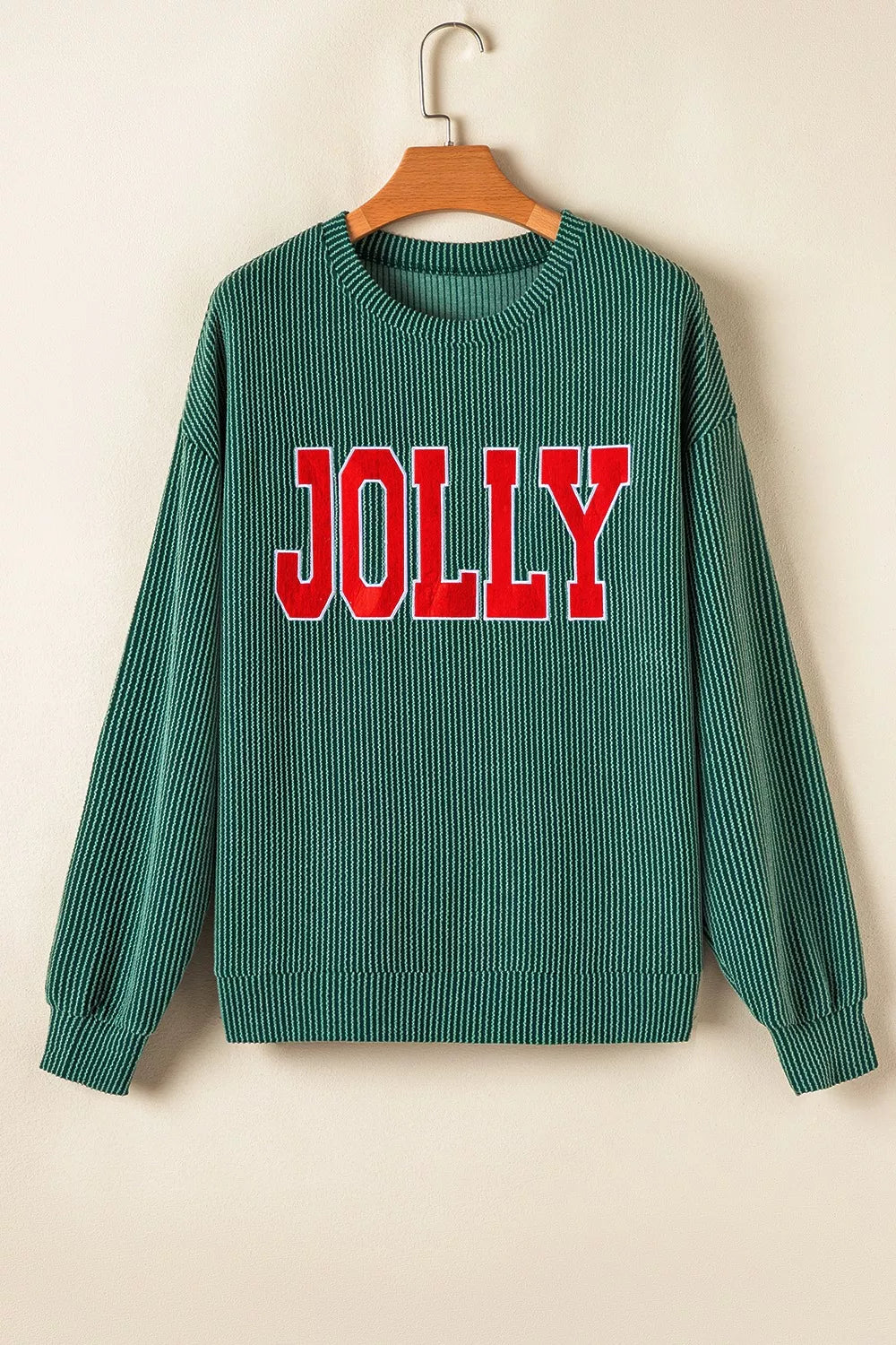 Green polyester top with red "JOLLY" text paired with drawstring pants set.