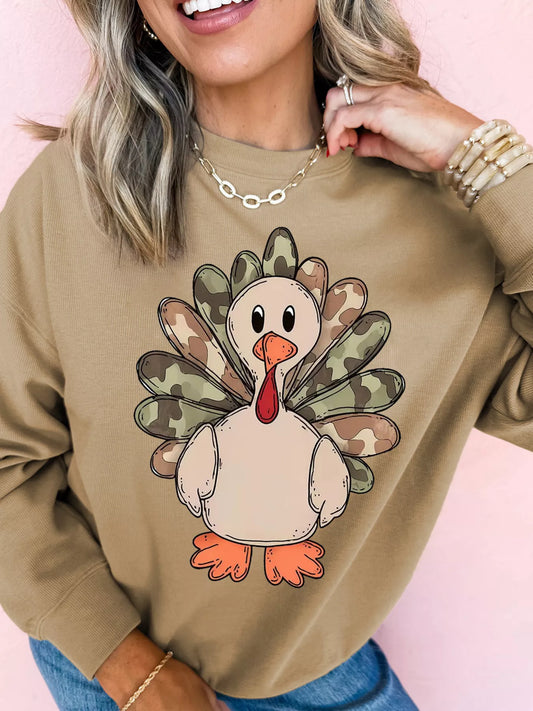 Beige sweatshirt with camouflage turkey graphic for Thanksgiving.