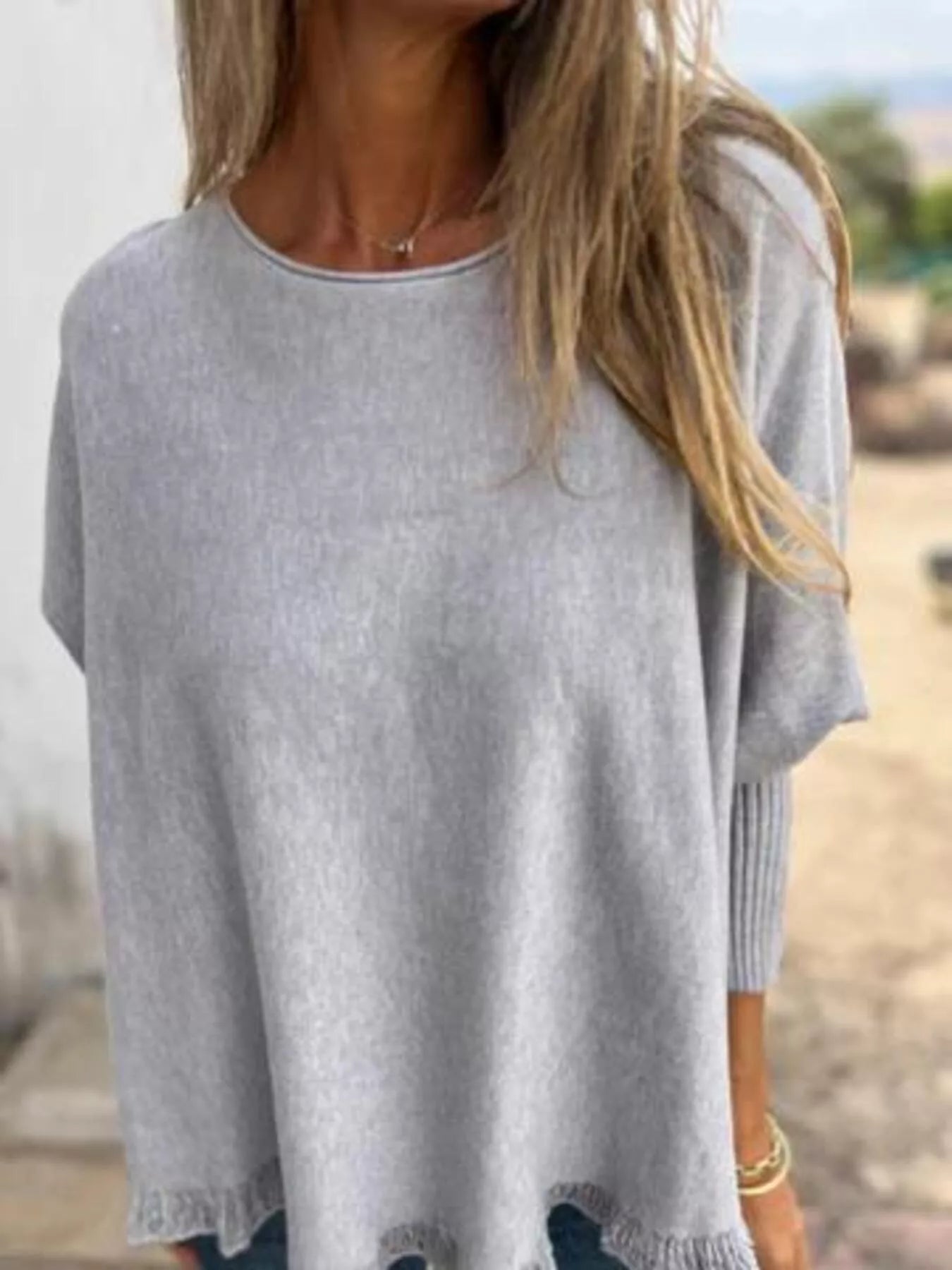 Plus size long sleeve knit top with round neck and delicate lace trim in soft fabric