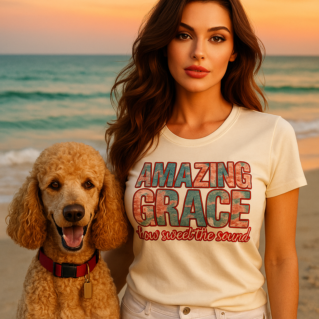 Woman wearing a 'Amazing Grace' t-shirt with a dog on a beach at sunset.