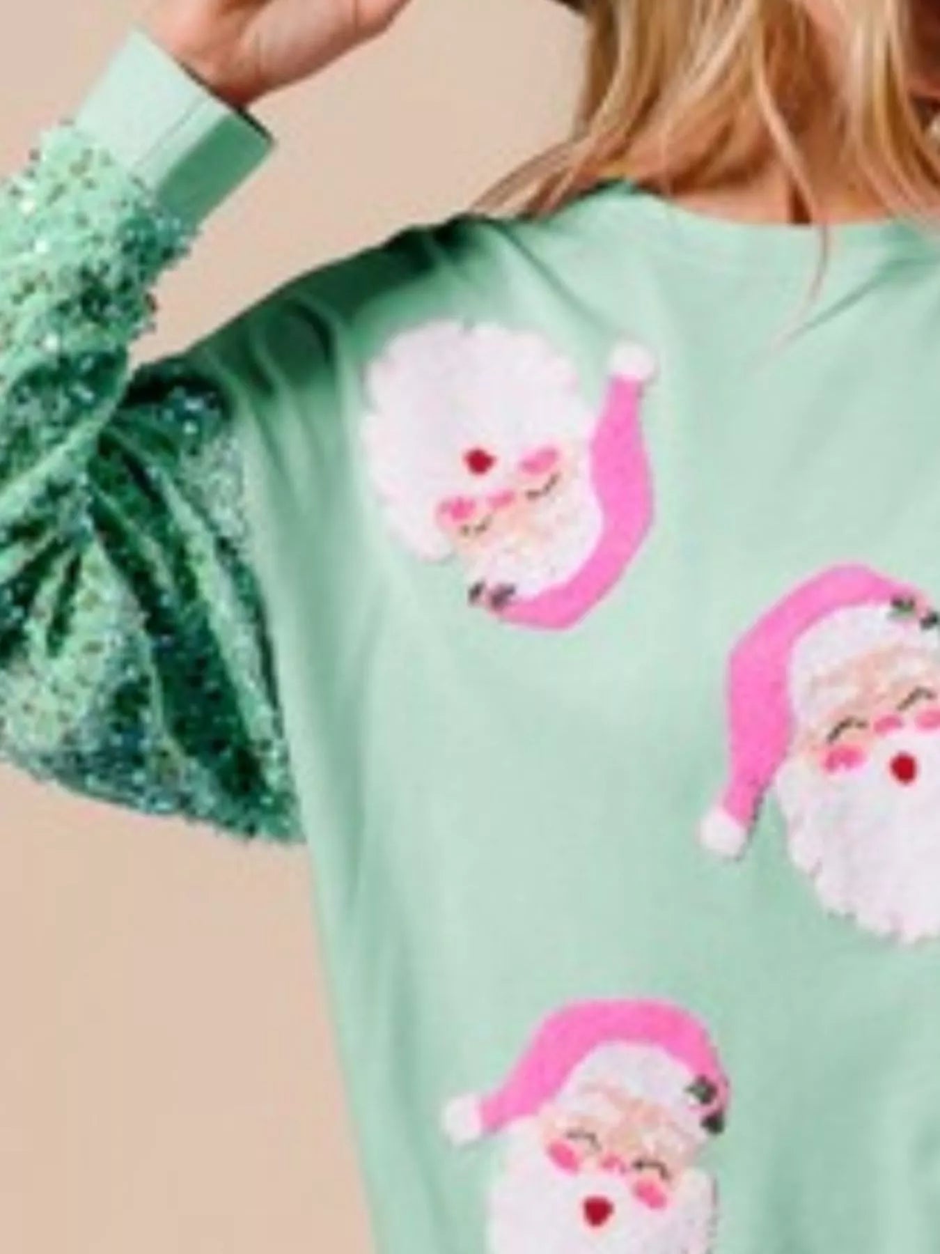 Long sleeve sweatshirt with sequins, perfect for holiday gatherings and casual wear.