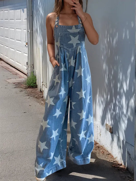 Wide leg denim overalls with star print and pockets, made from a cotton blend.