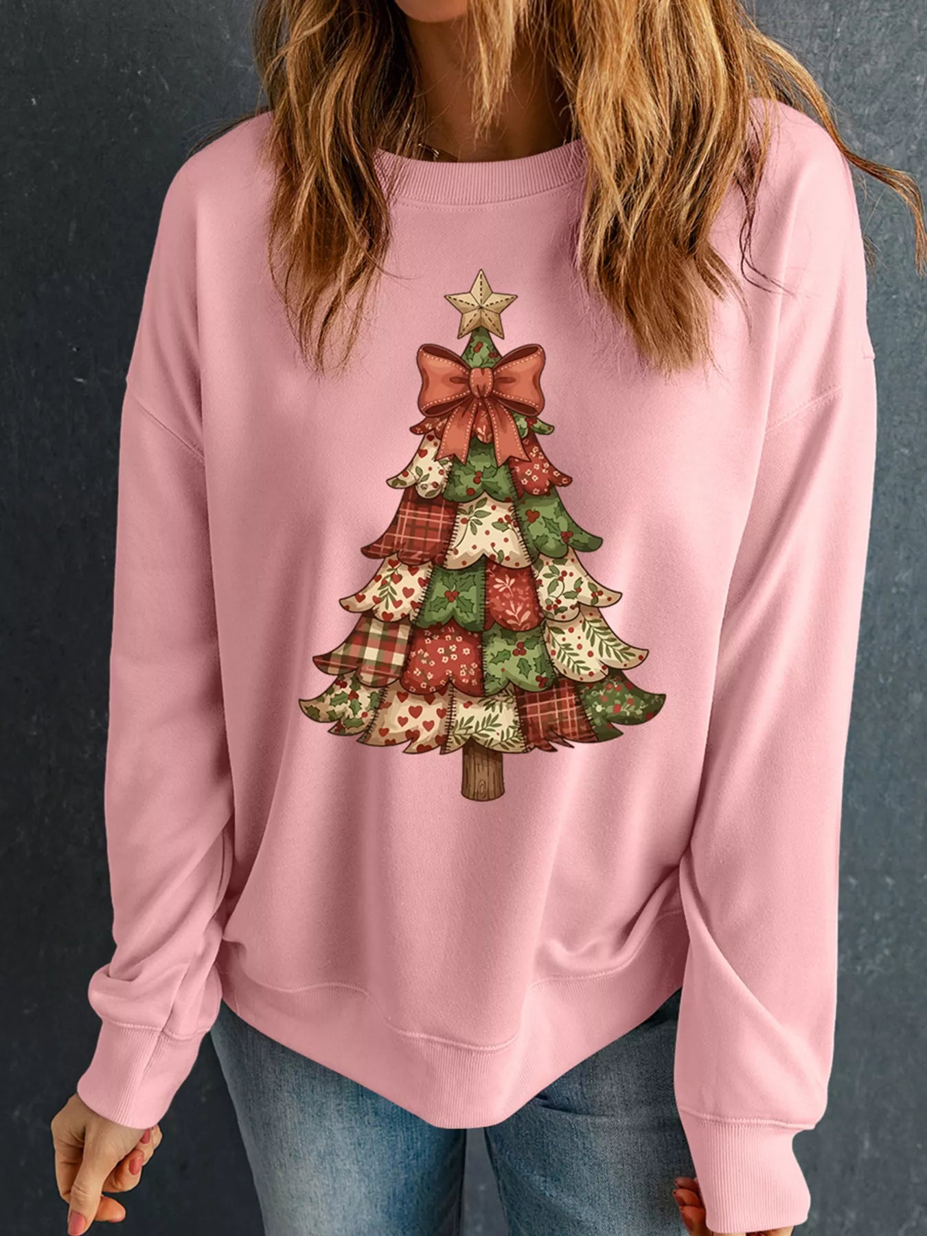 Long sleeve sweatshirt in a polyester cotton blend featuring a Christmas tree graphic.