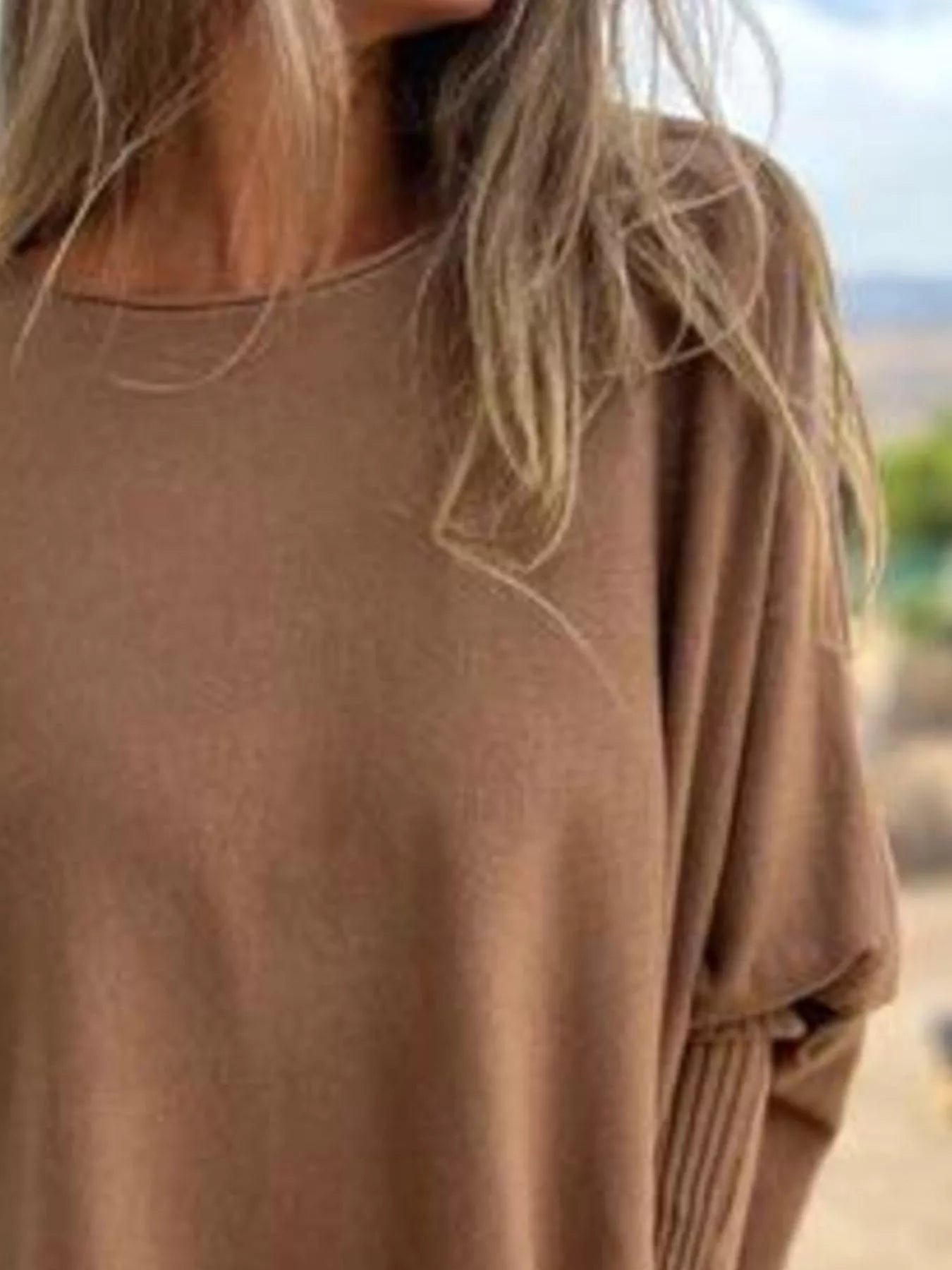 Plus size long sleeve knit top with round neck and delicate lace trim in soft fabric