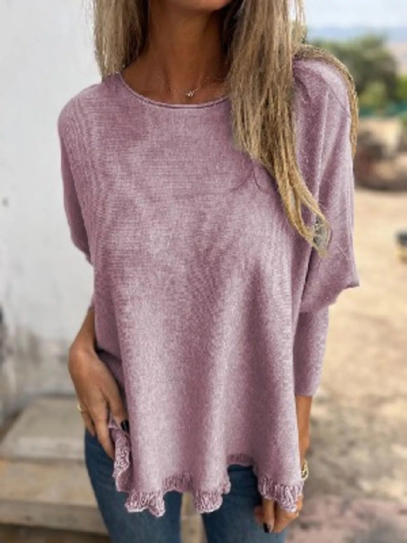 Plus size round neck long sleeve knit top with lace trim in soft polyester fabric.