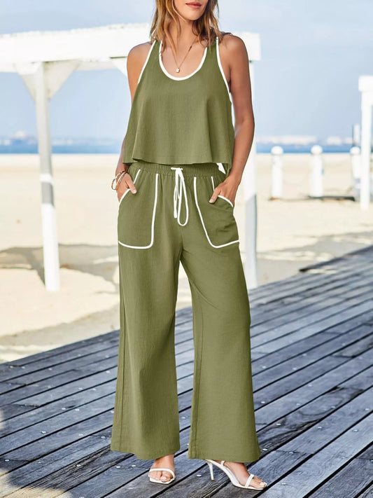 Two-piece tank and pants set with contrast trim, drawstring, and pockets in polyester spandex.
