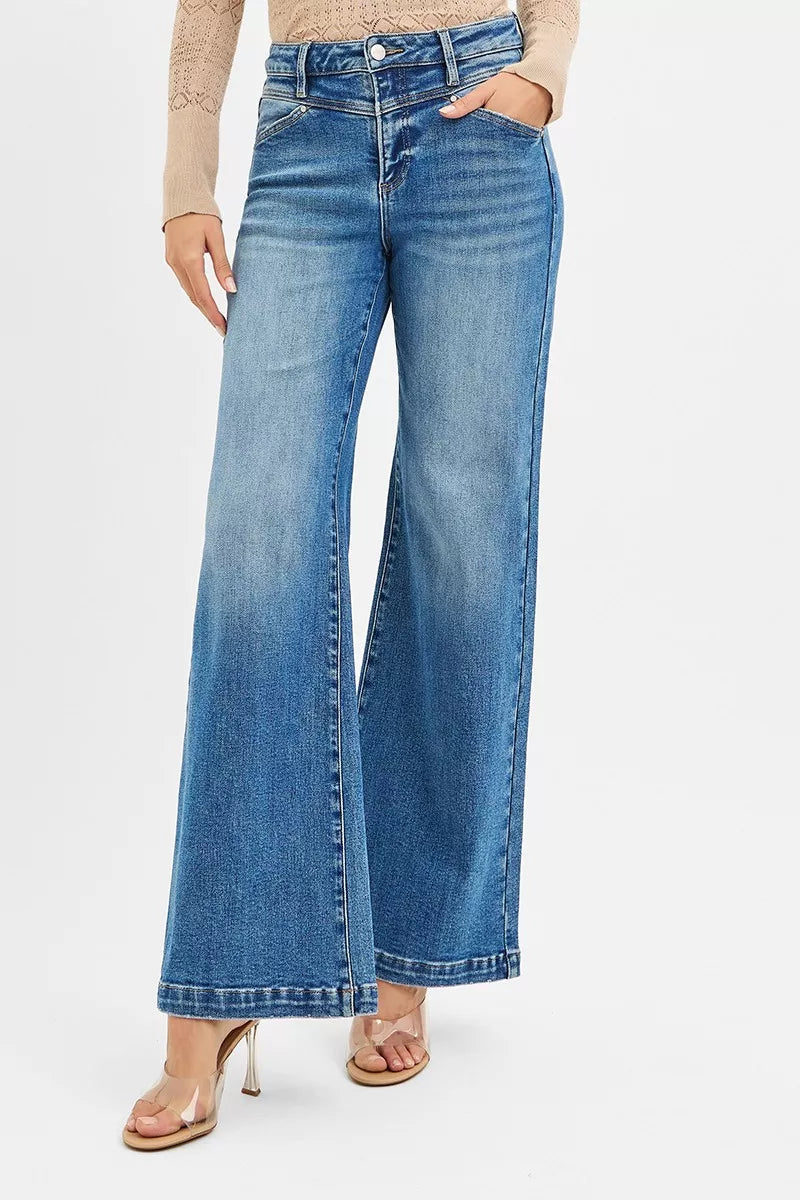 High-rise wide-leg jeans in light wash with heart-shaped back pockets, modeled on a woman.