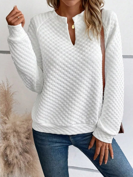 Textured sweatshirt with notched raglan sleeves and a relaxed fit in gray.