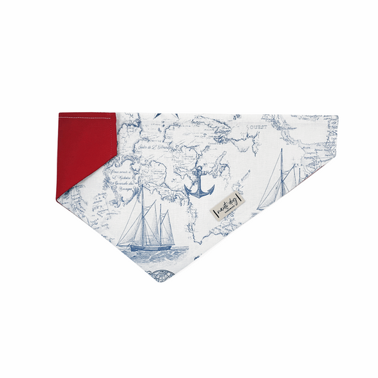 Light vintage nautical toile dog bandana with navy map print and red trim for over-collar wear.