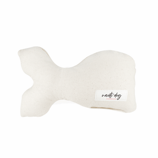 Ivory canvas stuffed whale dog toy with squeaker and "Nest Dog" label.