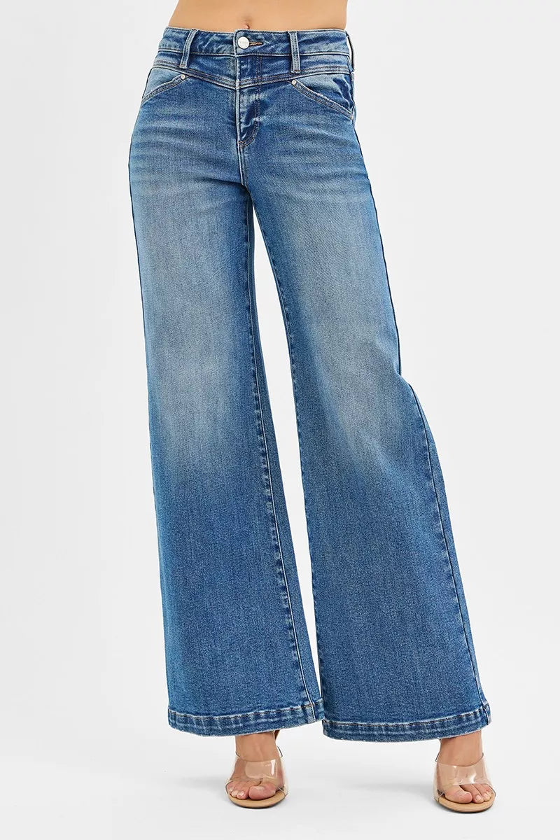 High-rise wide-leg jeans in light wash with heart-shaped back pockets, modeled on a mannequin.