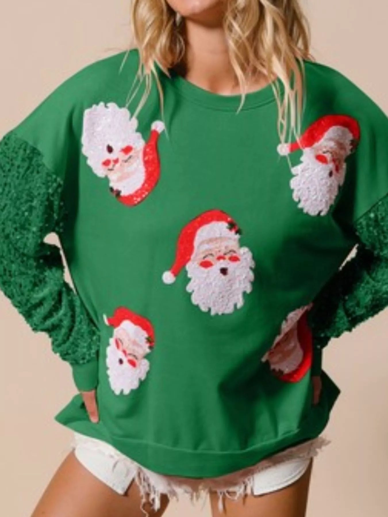 Long sleeve sweatshirt with sequins in a comfortable fit, perfect for holiday wear.