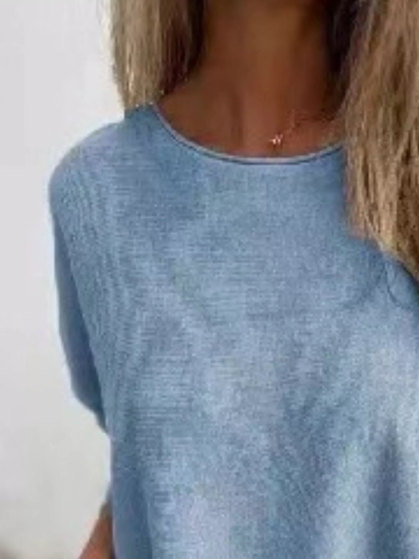 Plus size round neck long sleeve knit top with lace trim in soft polyester fabric.